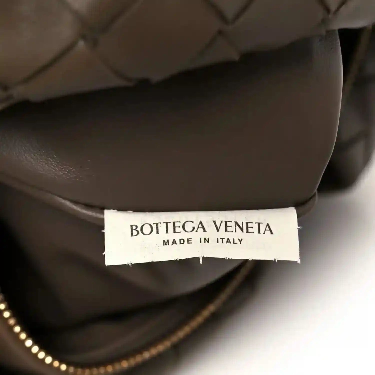 Taupe leather bag interior with Bottega Veneta label and “Made in Italy”