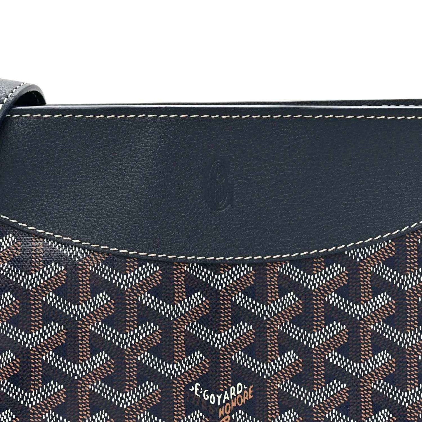 Navy shoulder bag flap with Goyard-pattern canvas and embossed logo