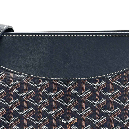 Navy shoulder bag flap with Goyard-pattern canvas and embossed logo