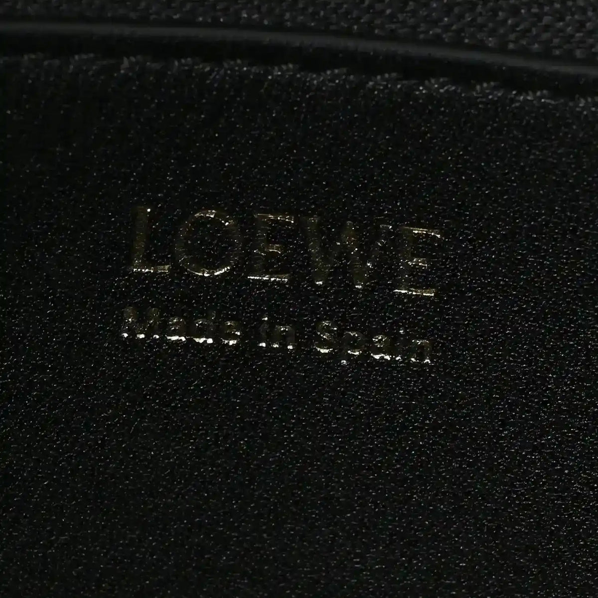 LOEWE logo on black leather bag