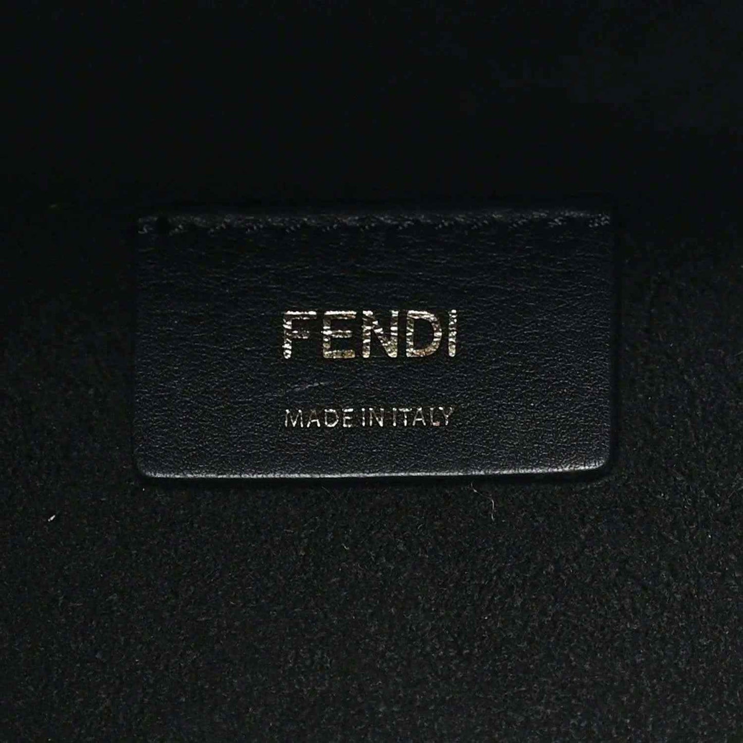 Black leather tote bag brand patch with FENDI and Made in Italy text