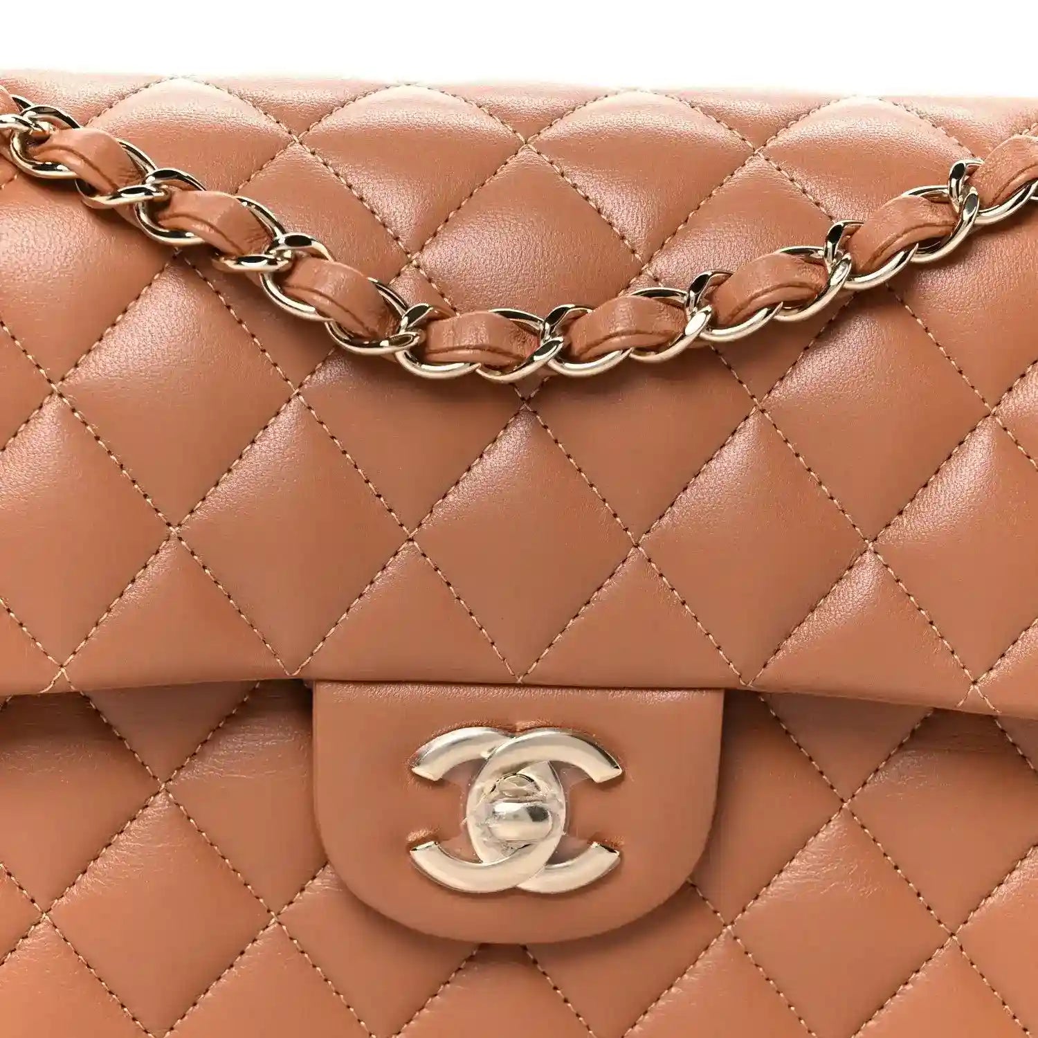 Front detail: quilted brown double flap with silver CC emblem and braided chain strap.