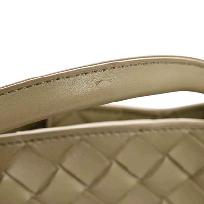 Tan nappa leather shoulder bag handle edge with top-stitching detail