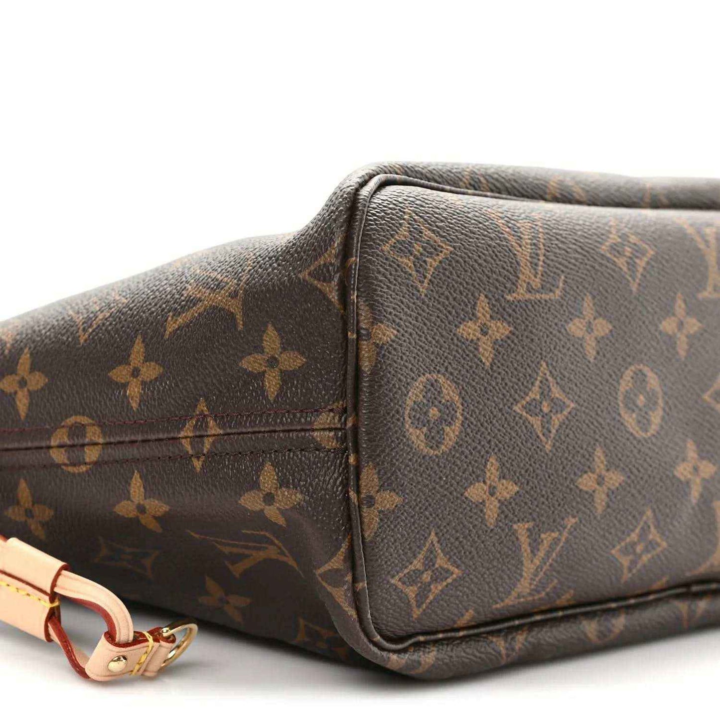Louis Vuitton monogram canvas tote corner view with leather trim and strap loop