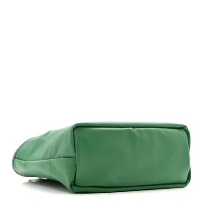 Green reversible mini tote bag with zip-top and rounded shoulder strap