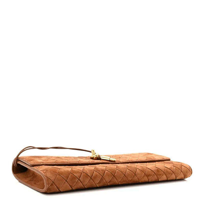 Amber suede intrecciato clutch with top handle and side profile