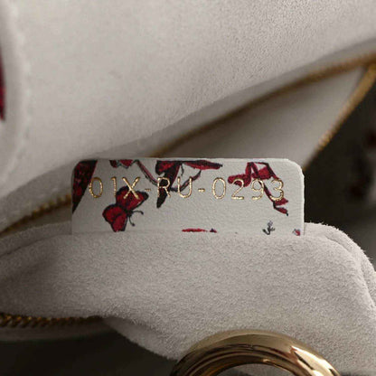 Handbag interior label with “Dior” and style number near zipper lining seams