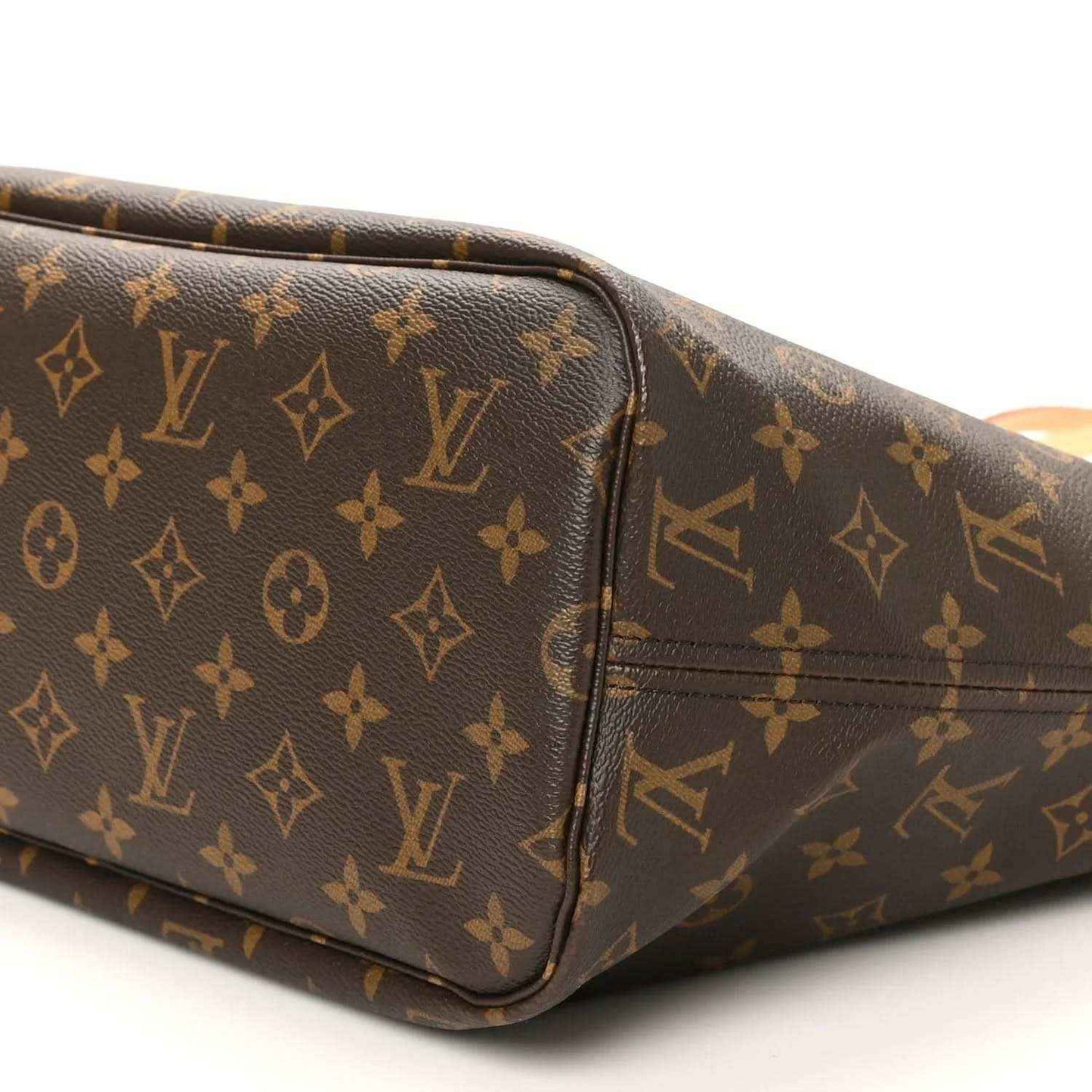 Louis Vuitton monogram tote bag corner detail, dark brown canvas with tan edge trim