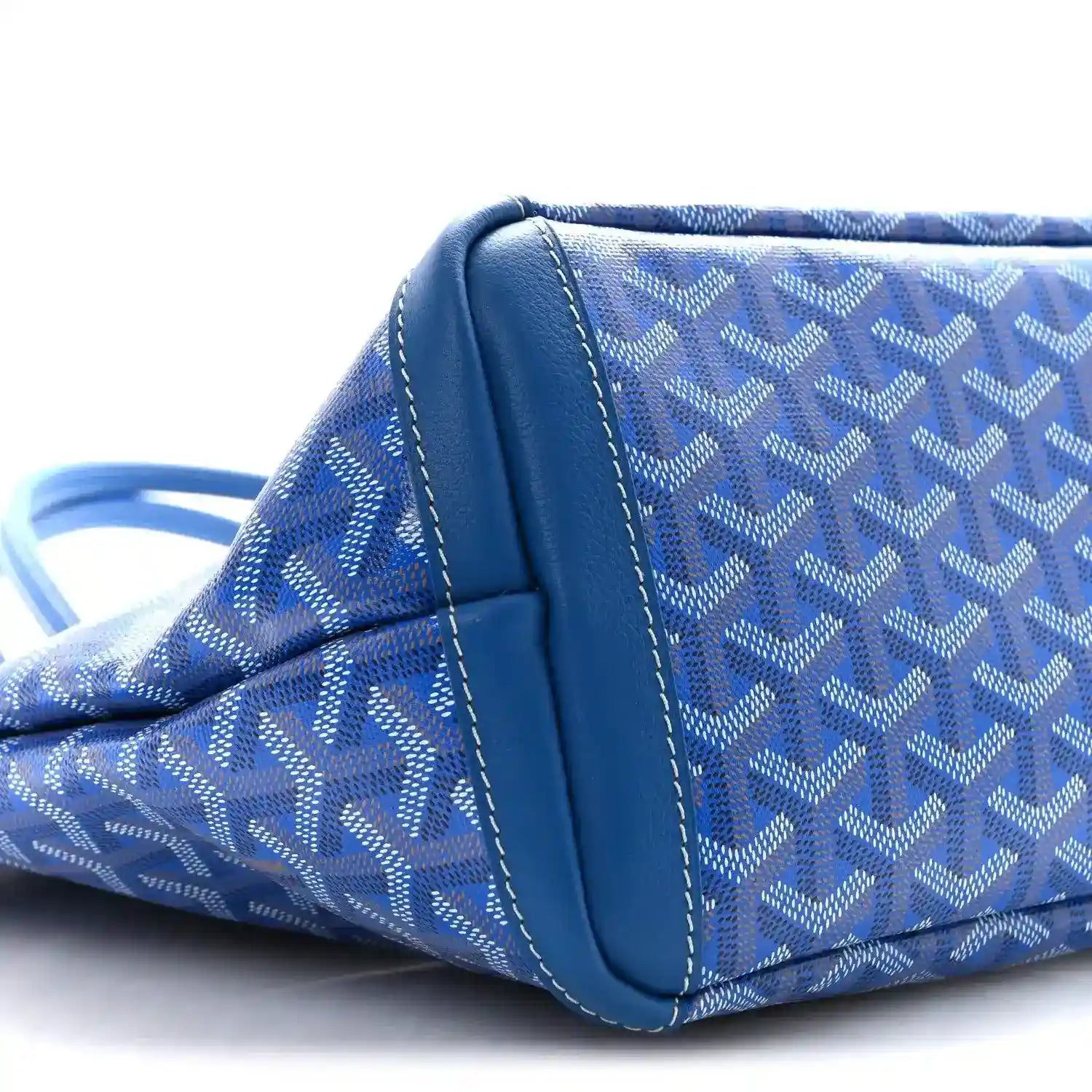 Close-up of sky blue tote bag corner with contrast trim and stitched seam detail