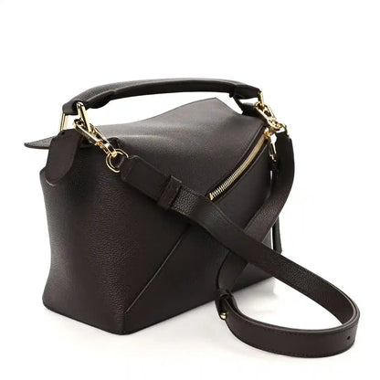 Dark chestnut grained leather small bag with gold-tone hardware and long crossbody strap