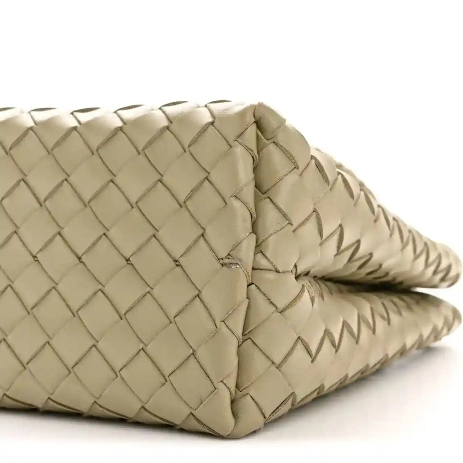 Woven leather tote corner with rolled strap edge, light tan