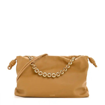 Tan leather drawstring clutch with braided chain shoulder strap