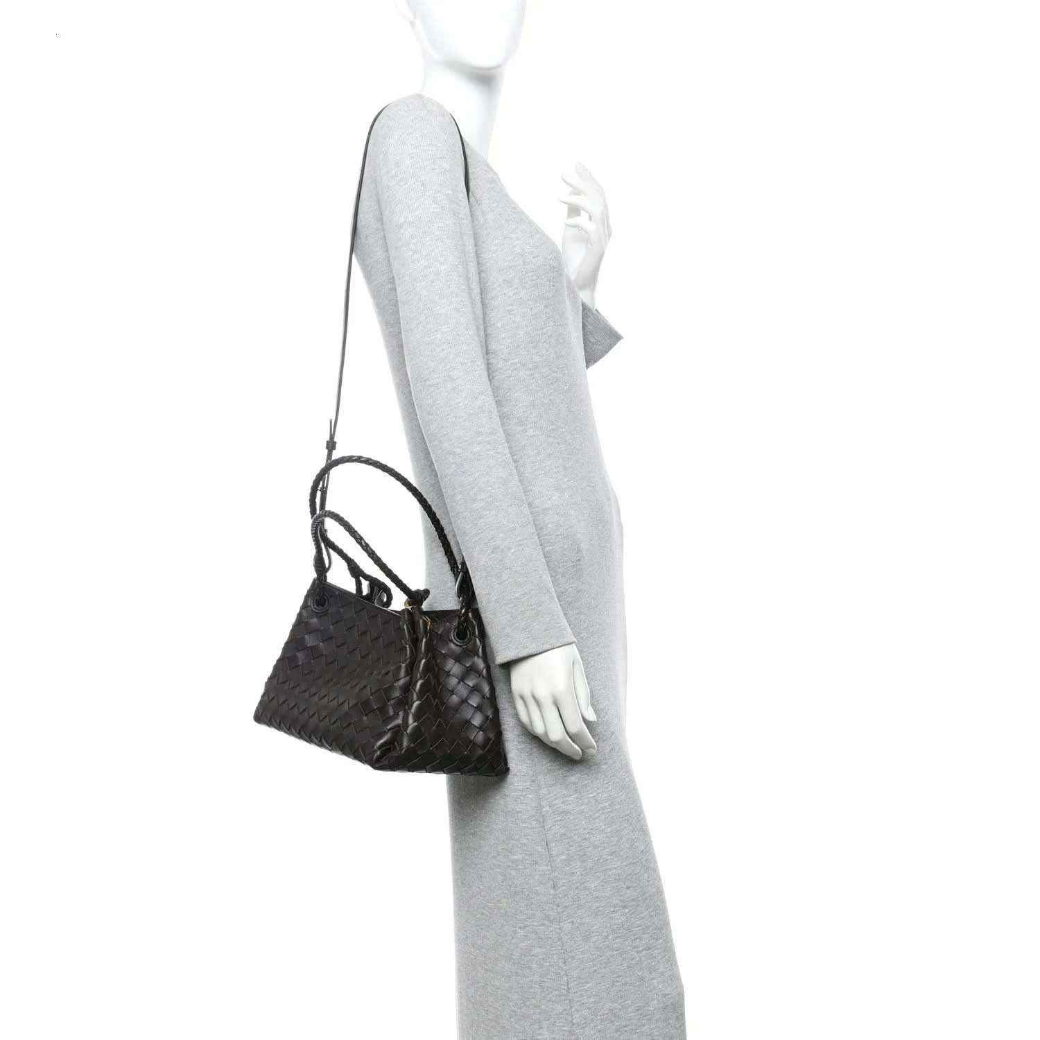 Black intrecciato shoulder bag with adjustable crossbody strap