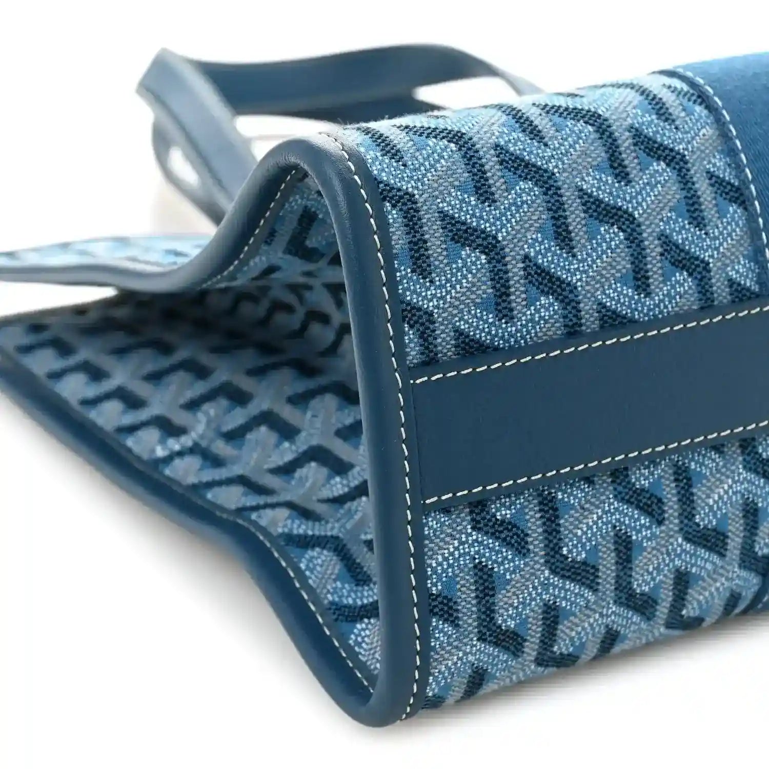 Ocean blue Villette PM tote corner detail with monogram fabric, leather trim, and stitching.