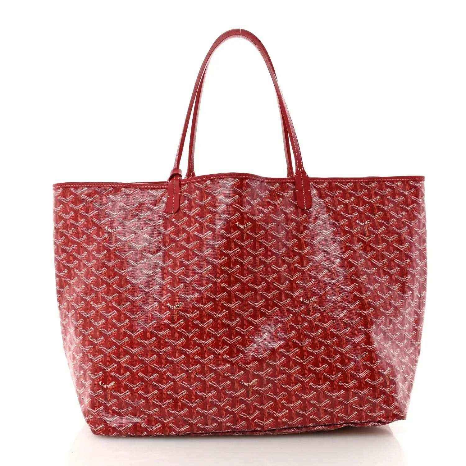 Red Goyardine canvas tote bag with Goyard pattern and top handles.