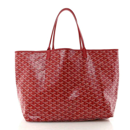 Red Goyardine canvas tote bag with Goyard pattern and top handles.
