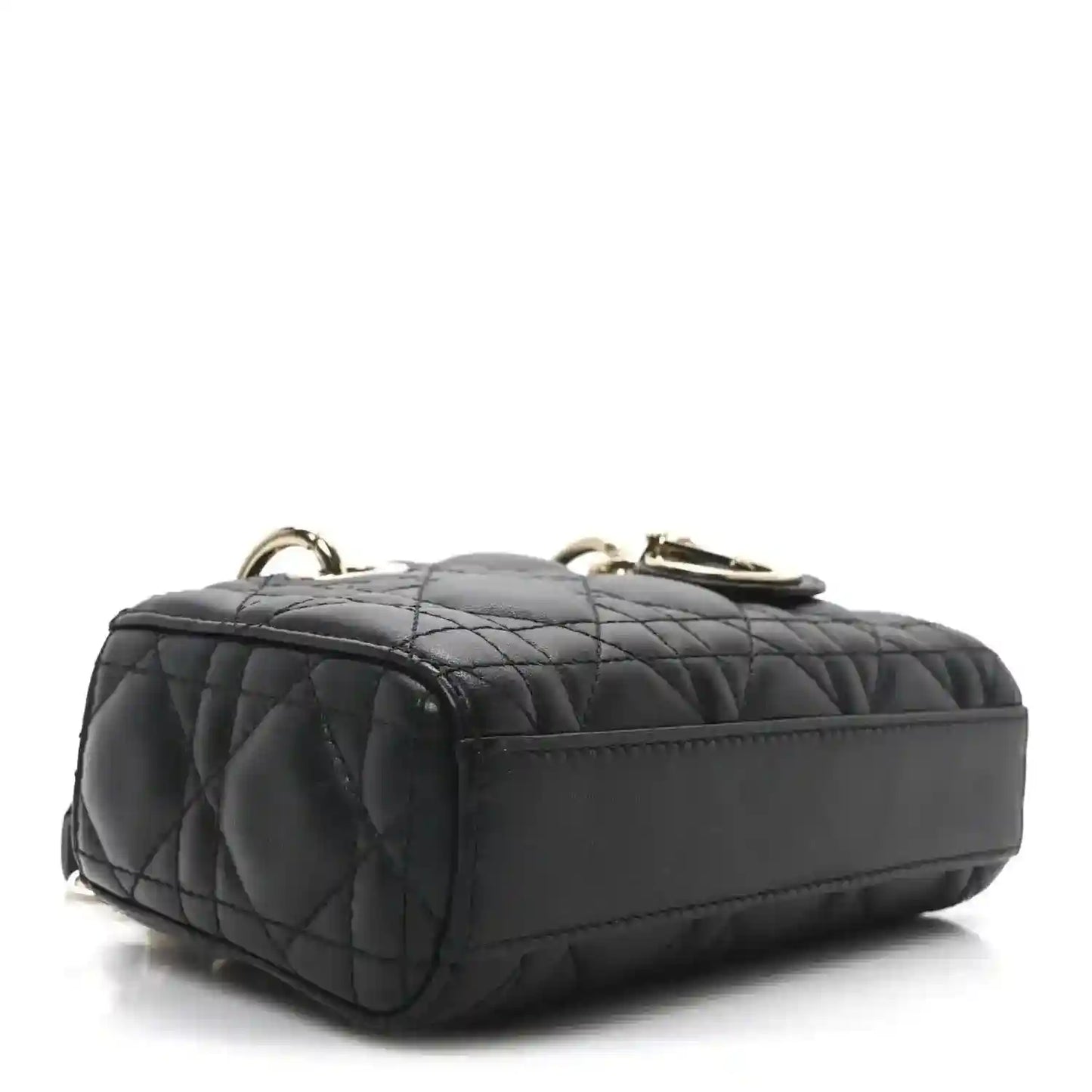 Black quilted mini handbag with rounded top and gold-tone hardware loops