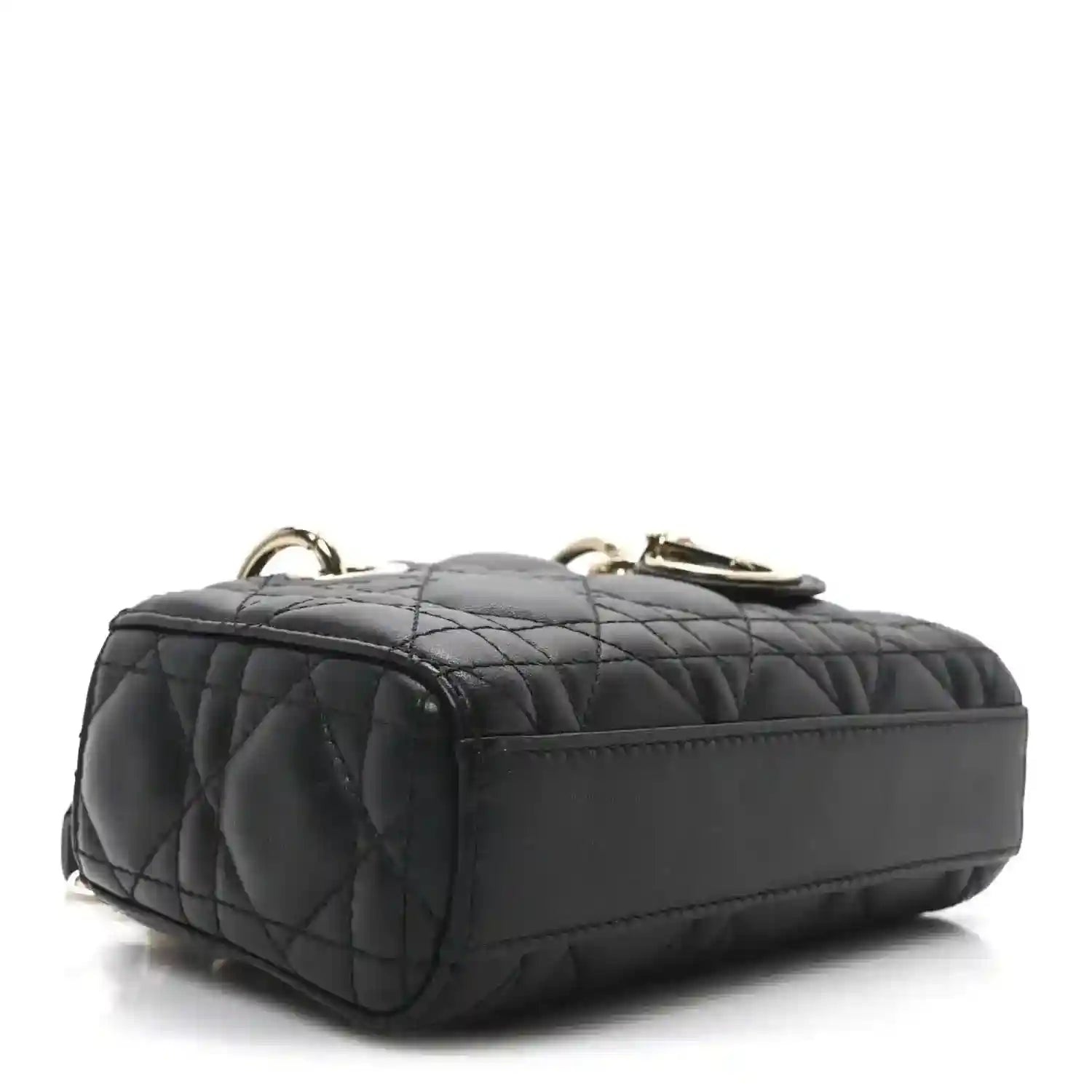 Black quilted mini handbag with rounded top and gold-tone hardware loops