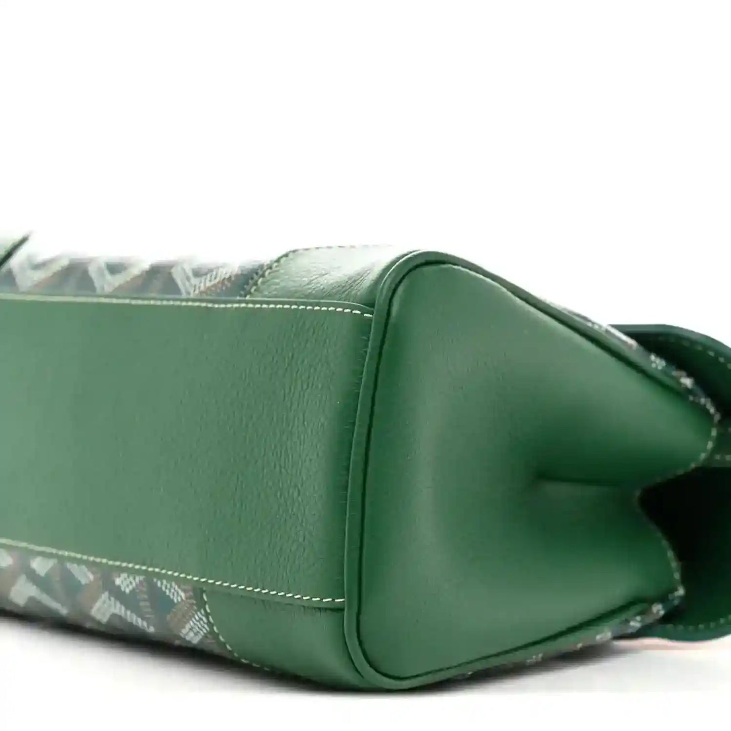 Close-up of the green mini Saigon bag side, showing flap stitching and chevron panel