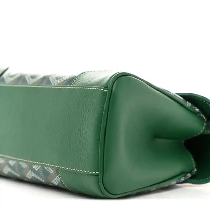 Close-up of the green mini Saigon bag side, showing flap stitching and chevron panel