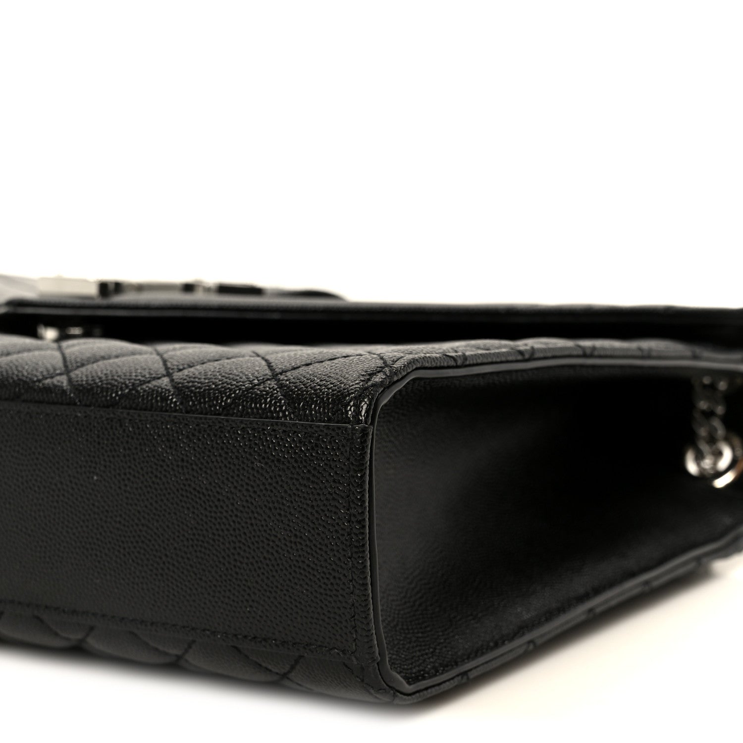 Black quilted leather satchel with structured corner and zipper trim