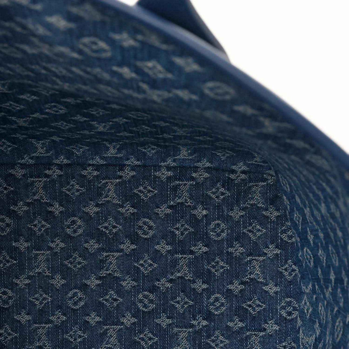 Denim blue leather tote bag close-up of textured Epi-style embossed pattern