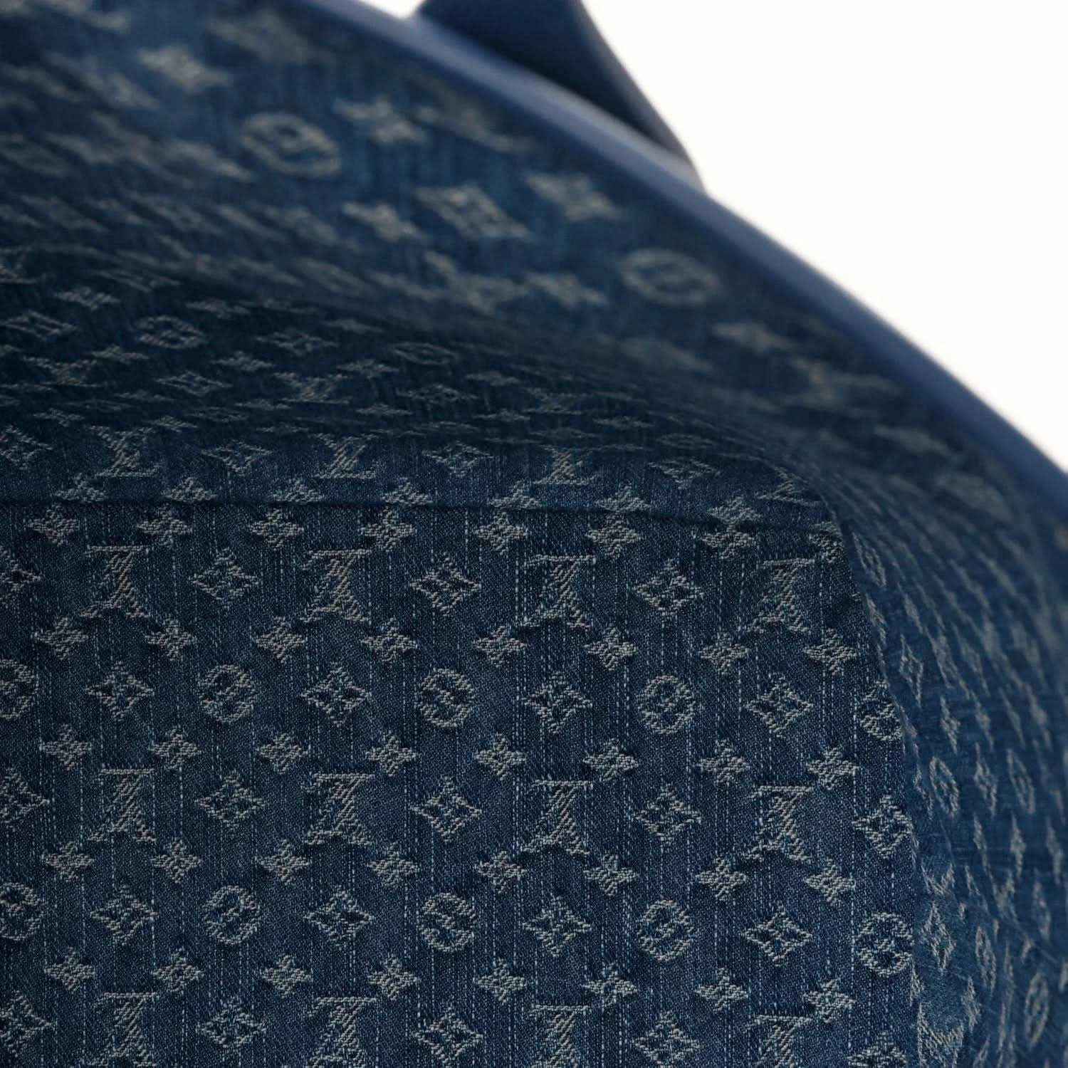 Denim blue leather tote bag close-up of textured Epi-style embossed pattern