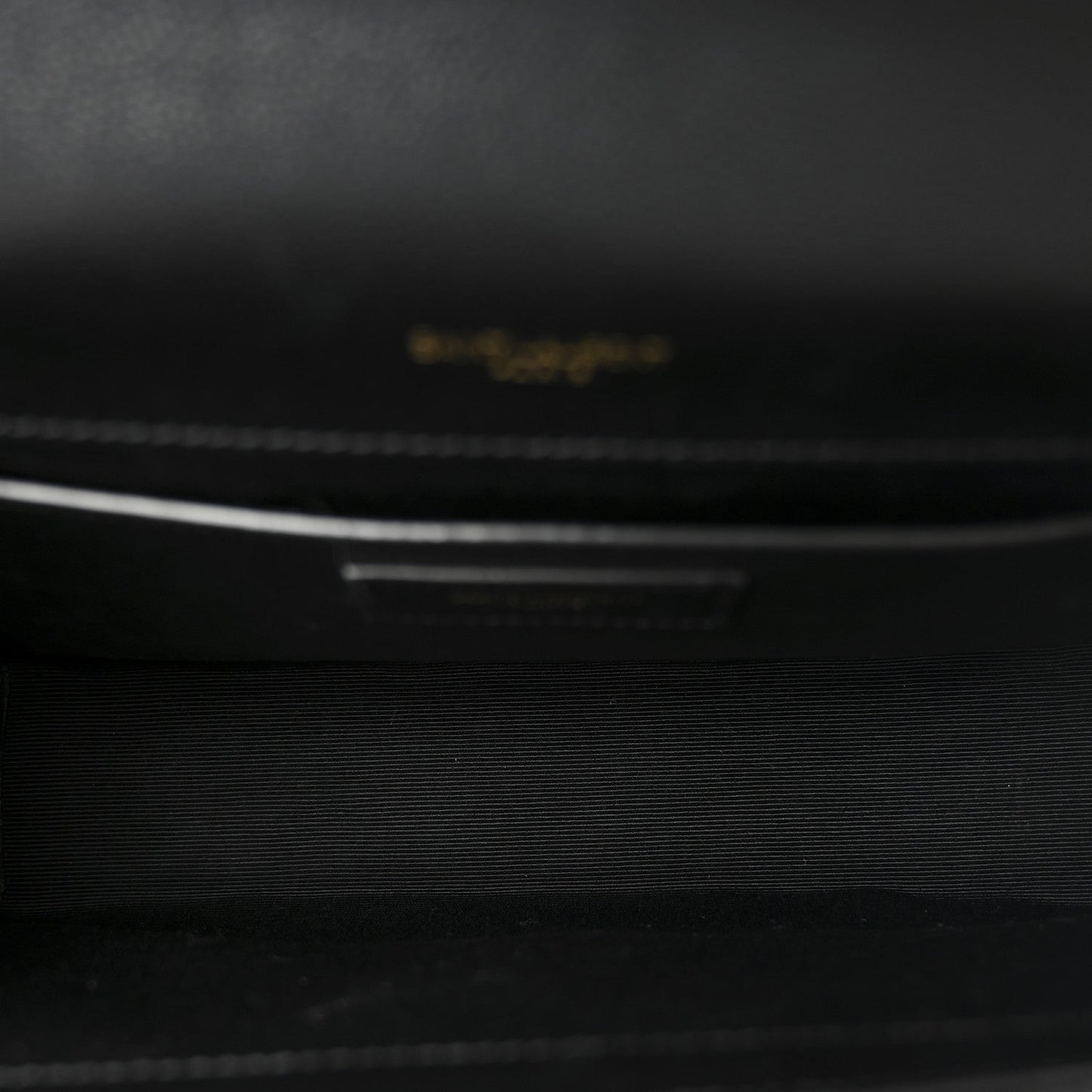Black leather interior with small embossed brand label