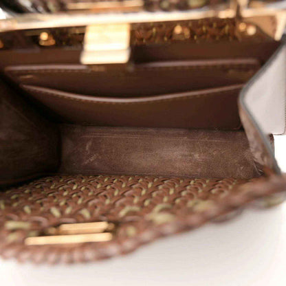 Brown leather interior lining visible inside an open woven satchel