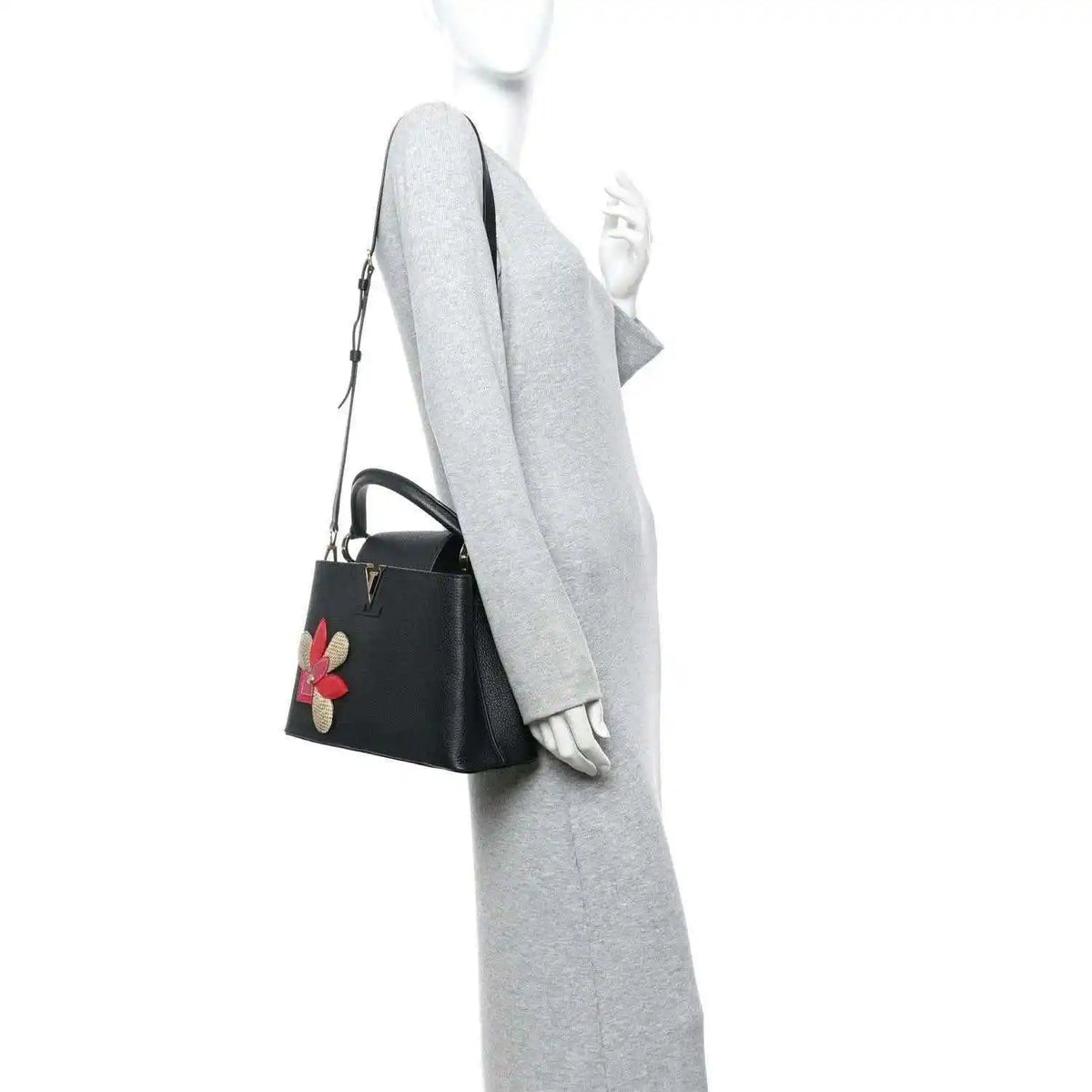 Louis Vuitton Capucines BB bag in black leather with flower applique and shoulder strap