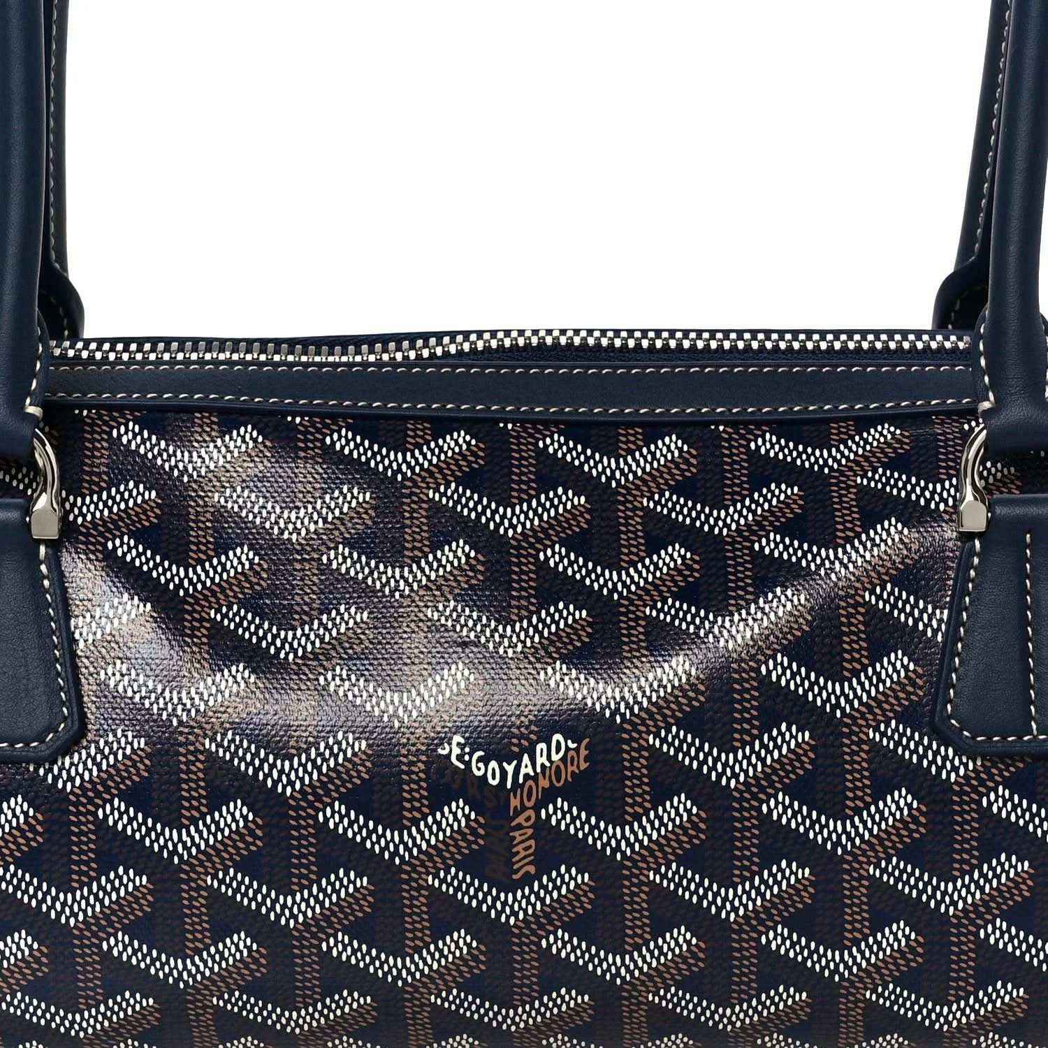 Close-up of patterned navy coated canvas Goyardine Bonbonniere bag front panel
