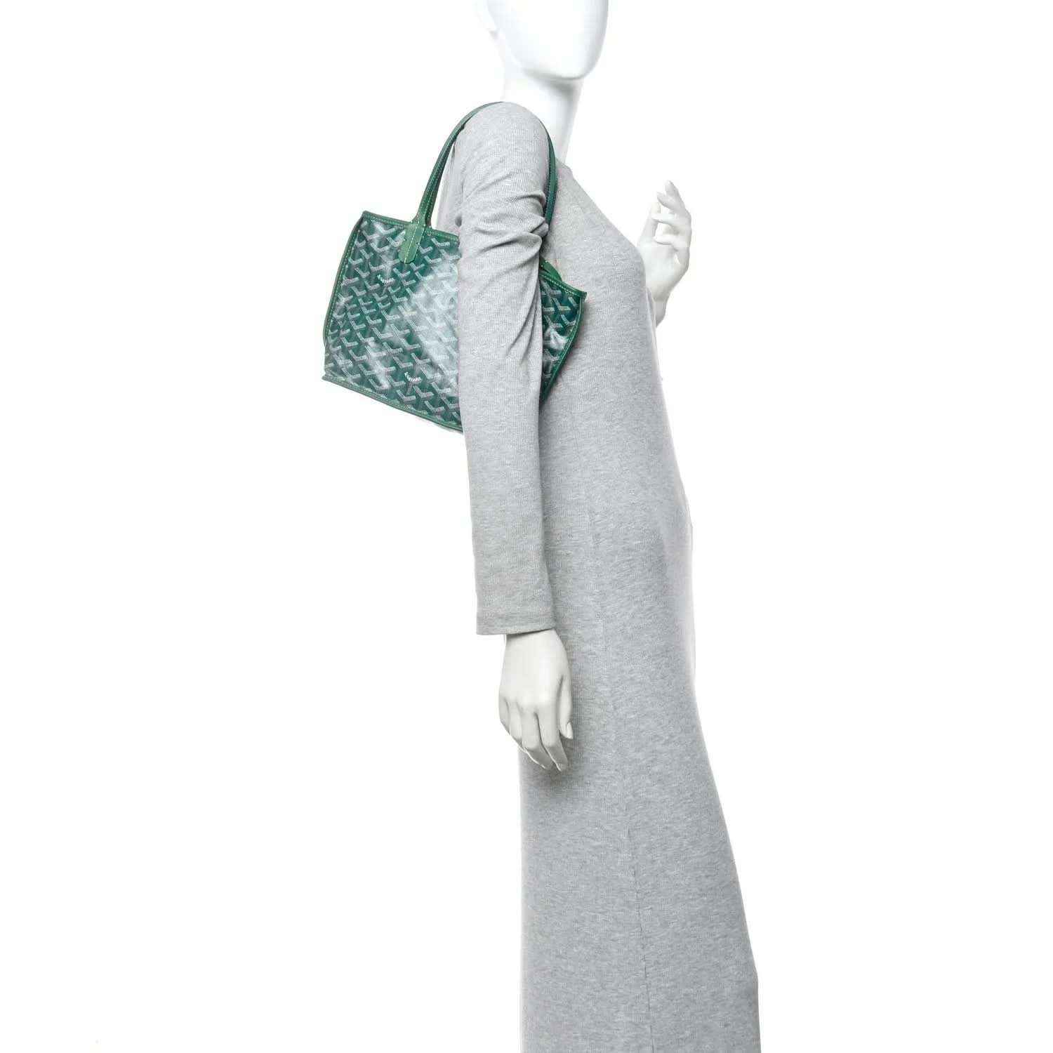 Green patterned mini tote bag carried at the side with double handles