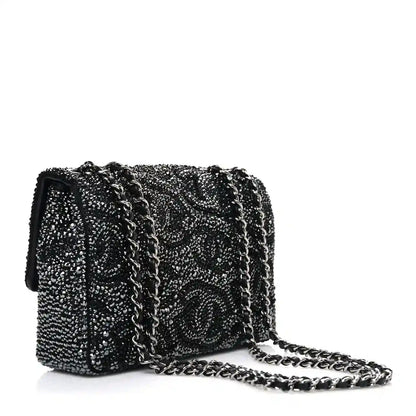 Black rhinestone small flap bag with CC medallion and long chain strap