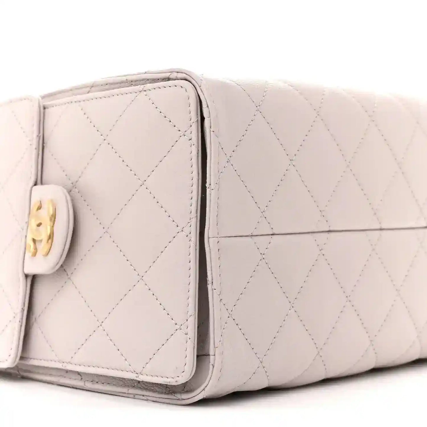 Lilac quilted small handbag side panel with front pocket flap and gold logo tab