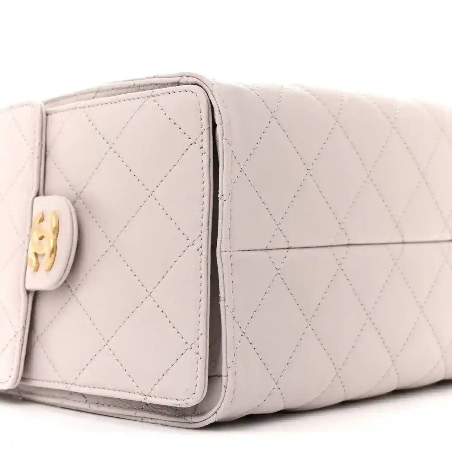 Lilac quilted small handbag side panel with front pocket flap and gold logo tab