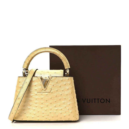 Yellow mini top-handle bag with LV logo and dust bag