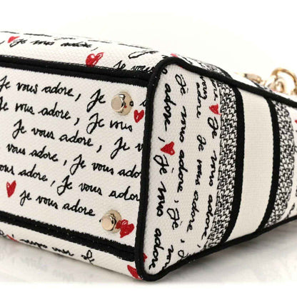 Medium Lady D-Lite bag side panel with Dioramour print, black piping, and gold rivets