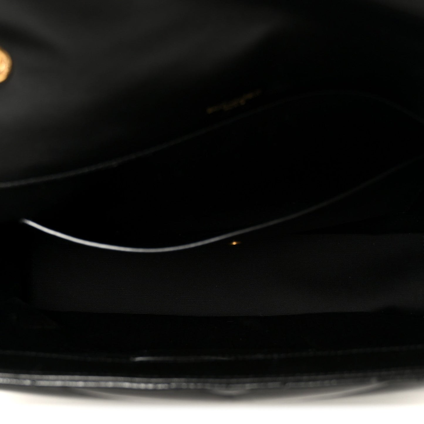 Close-up of black leather interior with zipper track