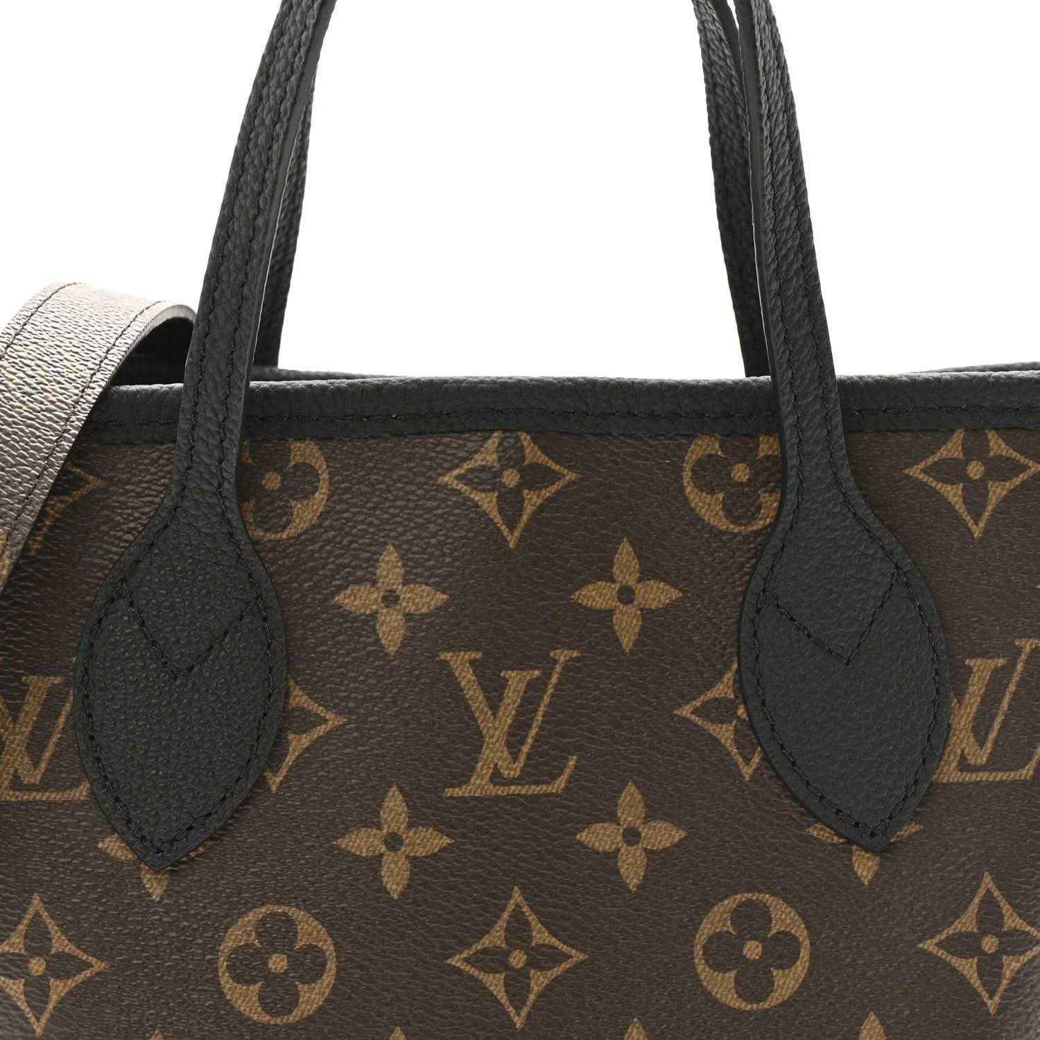 Monogram tote bag front close-up with black handles and brown patterned canvas and leather inserts