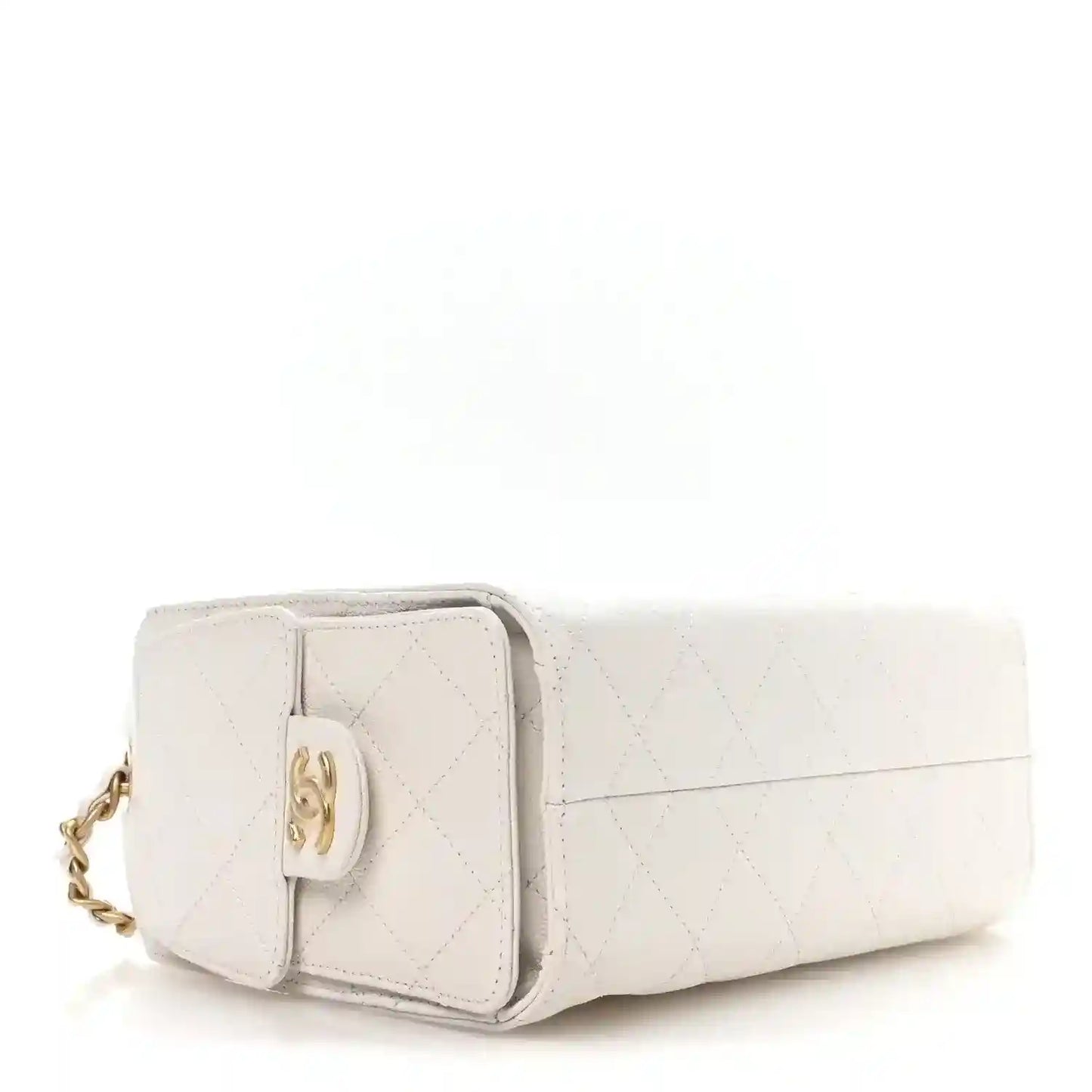 White quilted mini handbag with gold clasp and front flap, side view