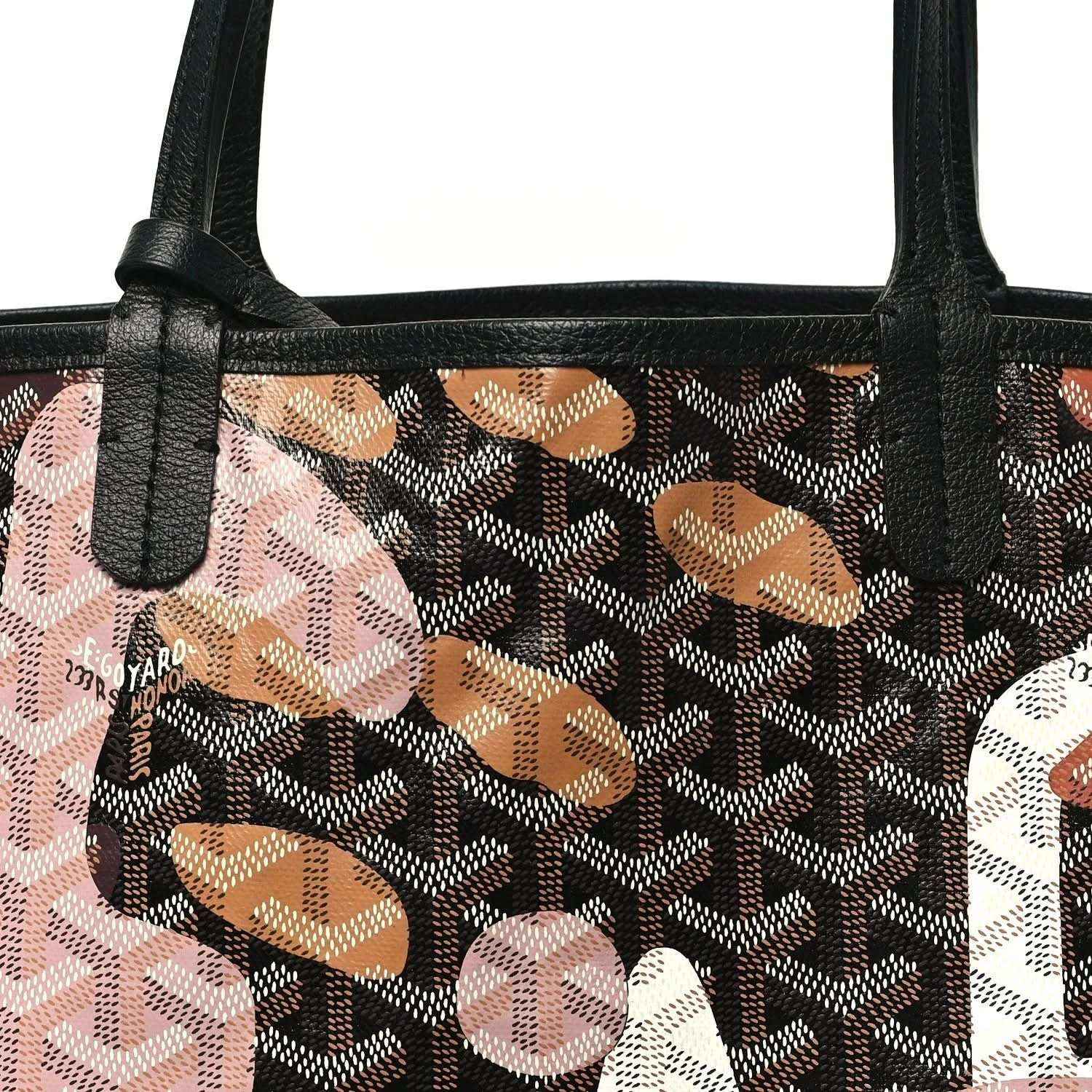 PM tote bag close-up: black handle base on dark monogram canvas with pink and orange graphics