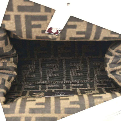 Fendi-lined clutch interior with monogram pattern and fabric trim visible