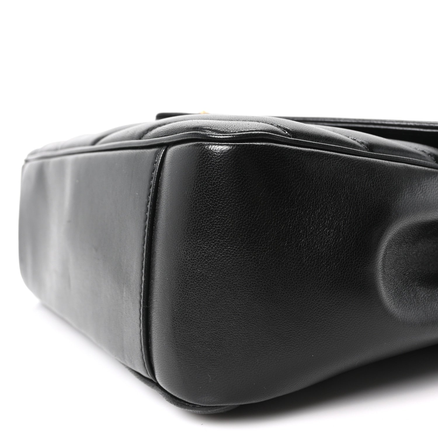 Black quilted lambskin shoulder bag with rounded corners and stitched seams