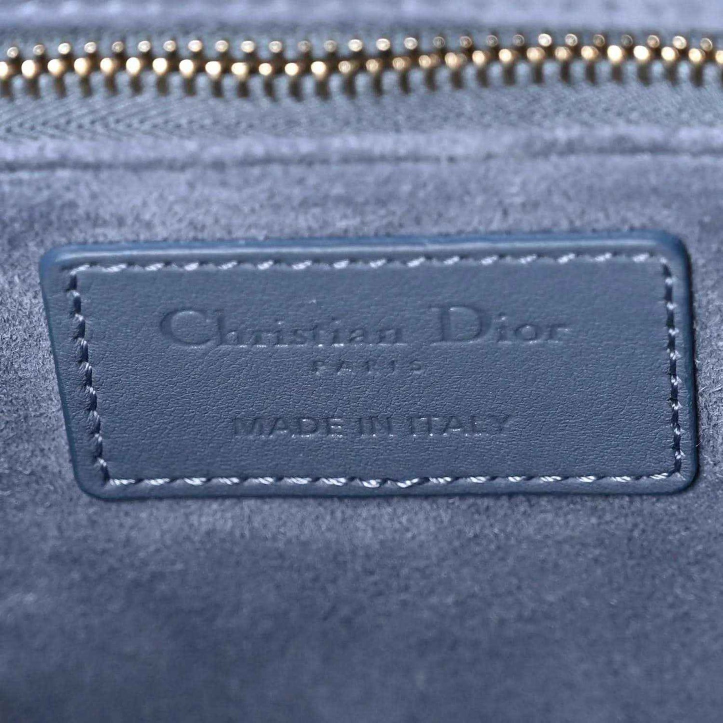 Christian Dior label patch on denim blue quilted Lady Dior bag