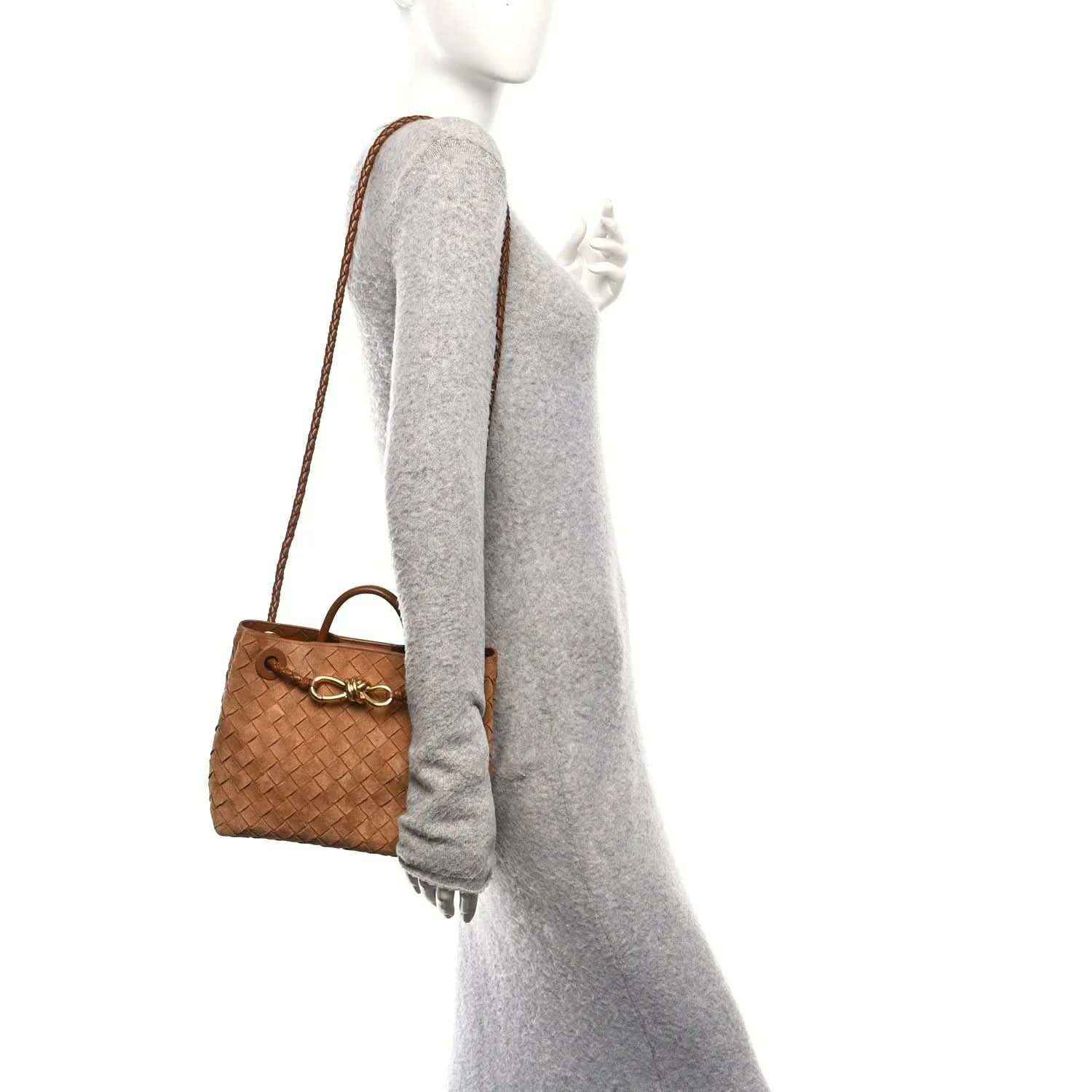Amber suede intrecciato shoulder bag on model, angled side view with short handle