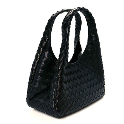 Black woven intrecciato leather shoulder bag with braided handles and tassel detail