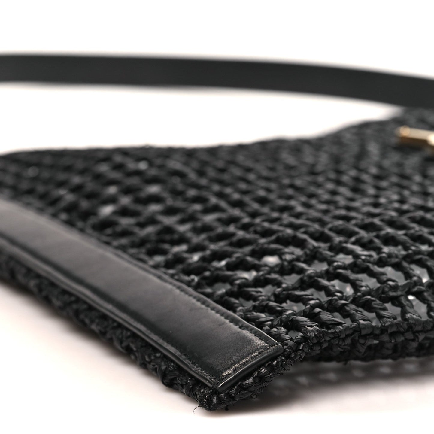 Black leather trim and shoulder strap on netted raffia bag base