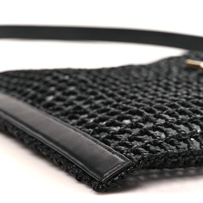Black leather trim and shoulder strap on netted raffia bag base