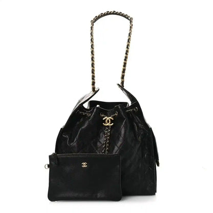 Black quilted leather handbag with chain handle and front flap pocket