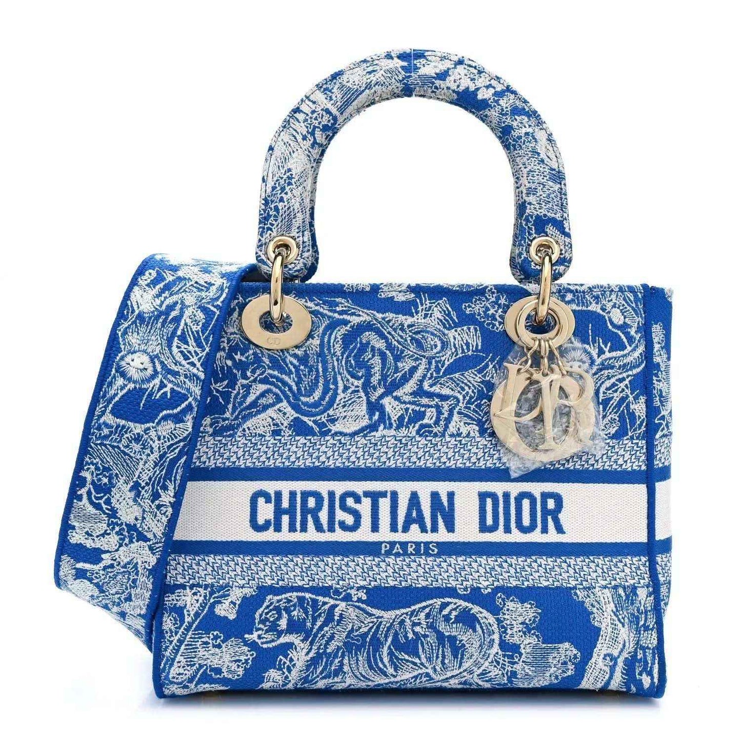 Dior tote bag in bright blue Toile de Jouy print with top handles and logo strip